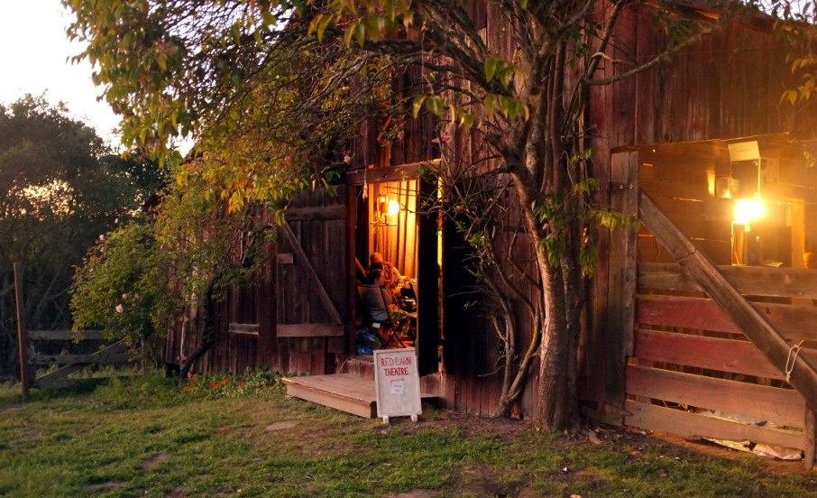 Our old red barn lit by sunset and stage lights - Watsonville, CA