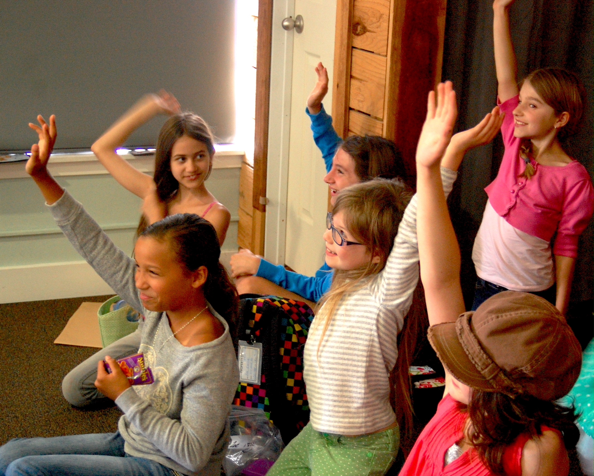 Kids engaged in discussion driven by story props  - LitWits Workshops creative activities projects and worksheets 