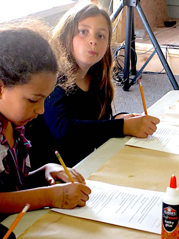 Kids writing dialogue in dialect to sound like Gollum, a LitWits creative activity for teaching THE HOBBIT by JRR Tolkien