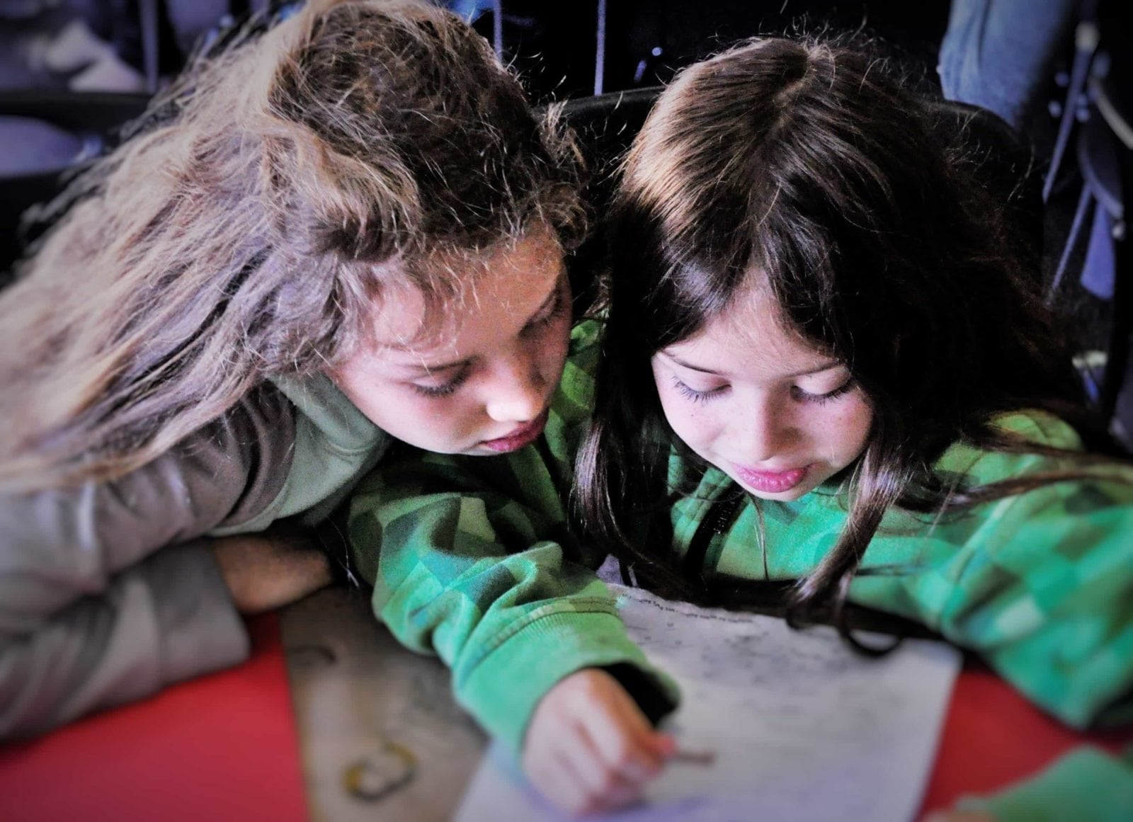 Children partnering on an activity idea for teaching FROM THE MIXED-UP FILES OF MRS. BASIL E. FRANKWEILER by E.L. Konigsburg