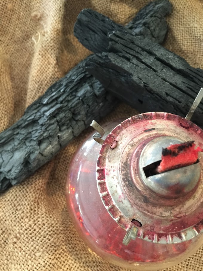 A kerosene lamp and some chunks of burnt wood symbolize the fire that destroyed the family's possessions, including Francisco's precious librito. - This kerosene lamp is a story prop idea for teaching THE CIRCUIT by Francisco Jiménez, from LitWits Workshops