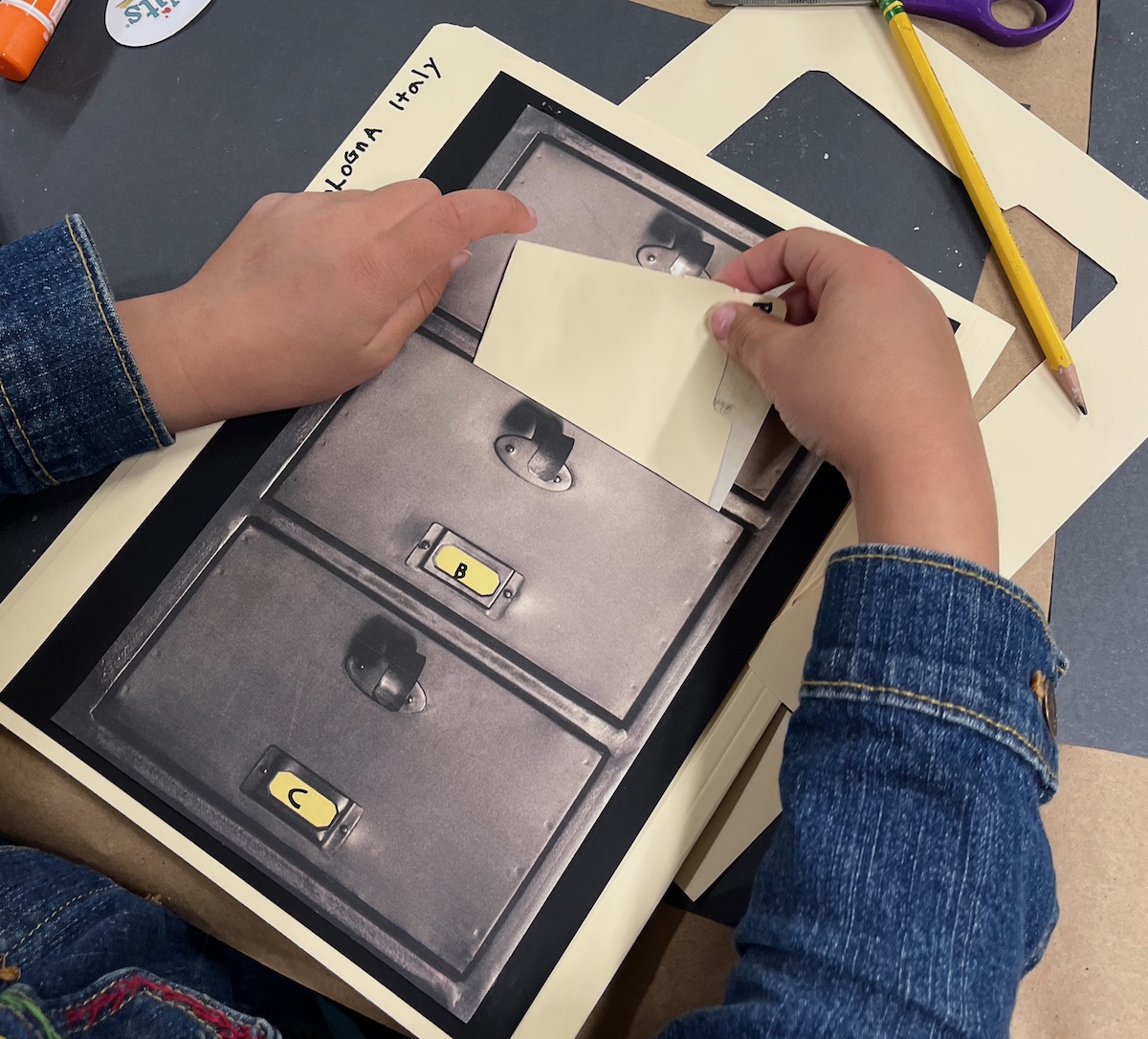 A child tucking the secret Bologna file (containing Michelangelo's sketch and sonnet) into Mrs. Frankweiler's mixed-up file cabinet - a LitWits creative activity idea for teaching FROM THE MIXED-UP FILES OF MRS. BASIL E. FRANKWEILER by E.L. Konigsburg